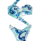 Two-piece swimsuit with blue and green abstract pattern on a white background